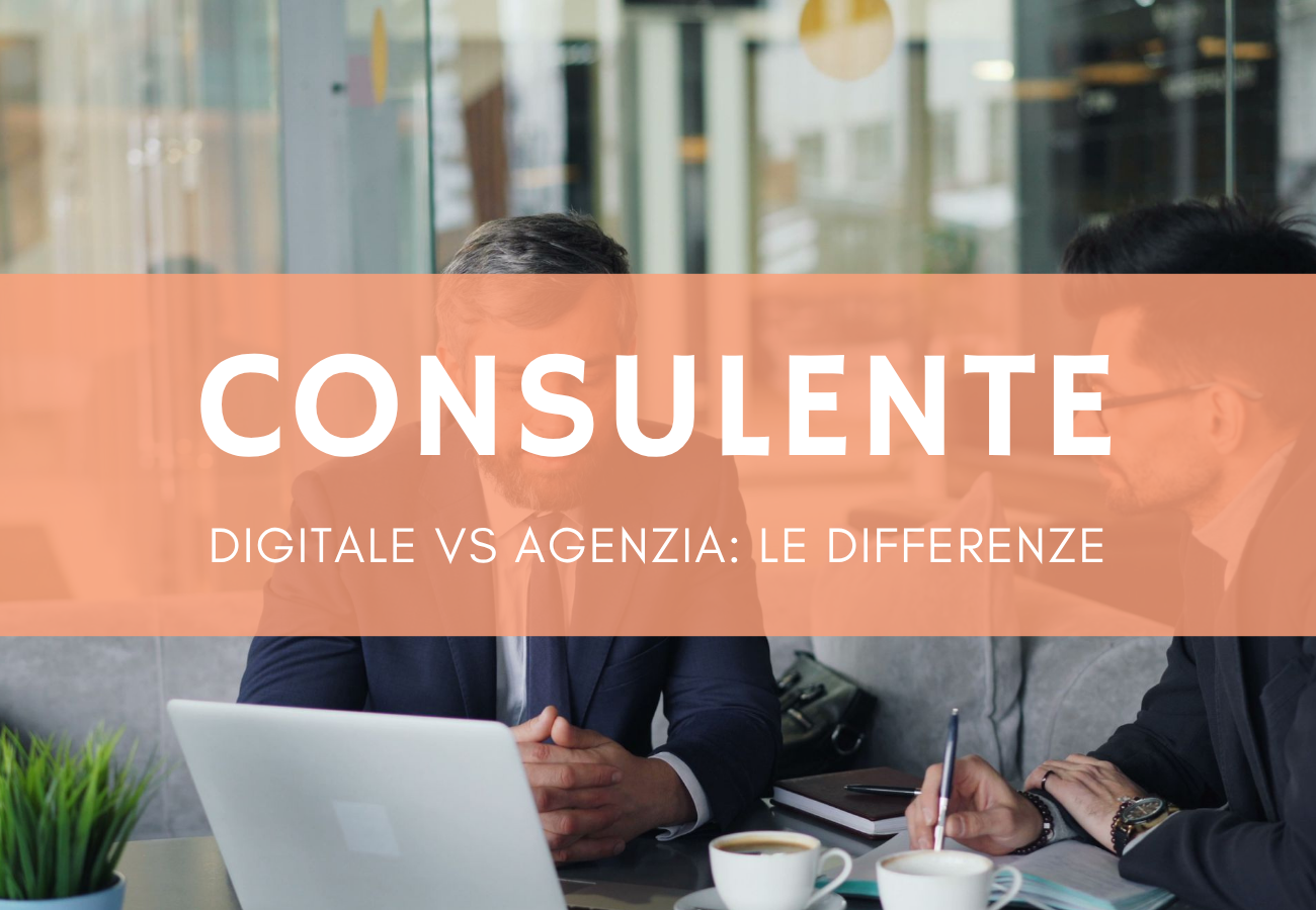 Due professionisti in riunione discutono strategia digitale per PMI al tavolo con laptop