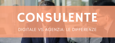 Due professionisti in riunione discutono strategia digitale per PMI al tavolo con laptop