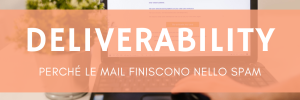 Persona che legge email su laptop alla scrivania con pianta decorativa in ufficio